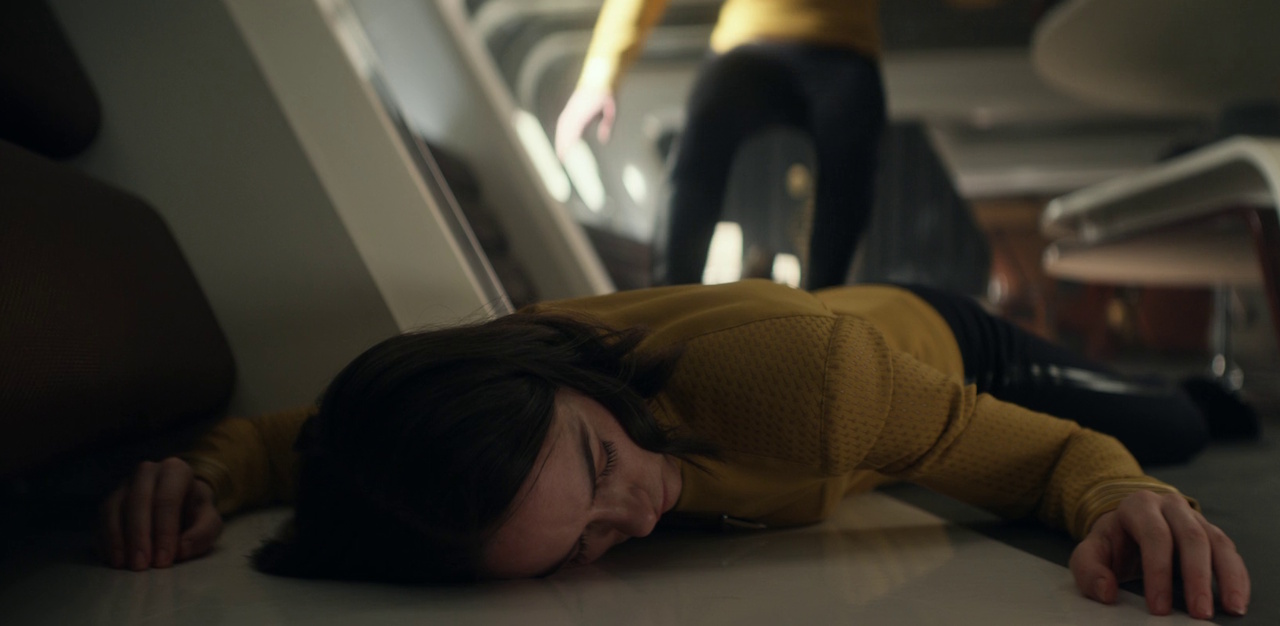 Still frame from Star Trek: Strange New Worlds 3x03: Shuttle to Kenfori, showing Captain Batel unconscious.