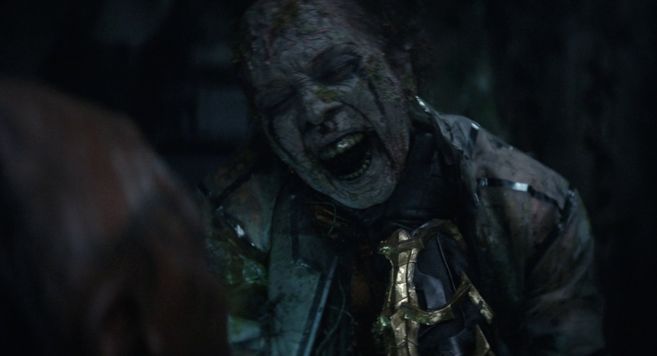 Still frame from Star Trek: Strange New Worlds 3x03: Shuttle to Kenfori, showing a zombie attacking a Klingon.