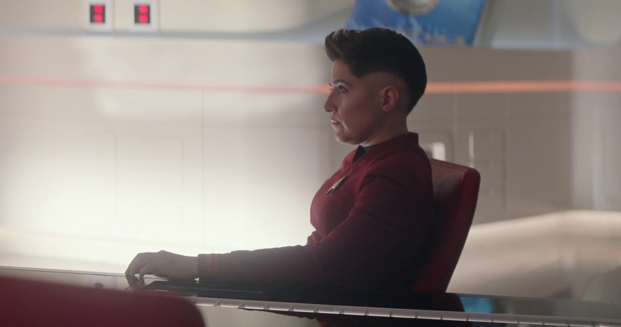 Still frame from Star Trek: Strange New Worlds 3x03: Shuttle to Kenfori, showing Ortegas in the briefing room.