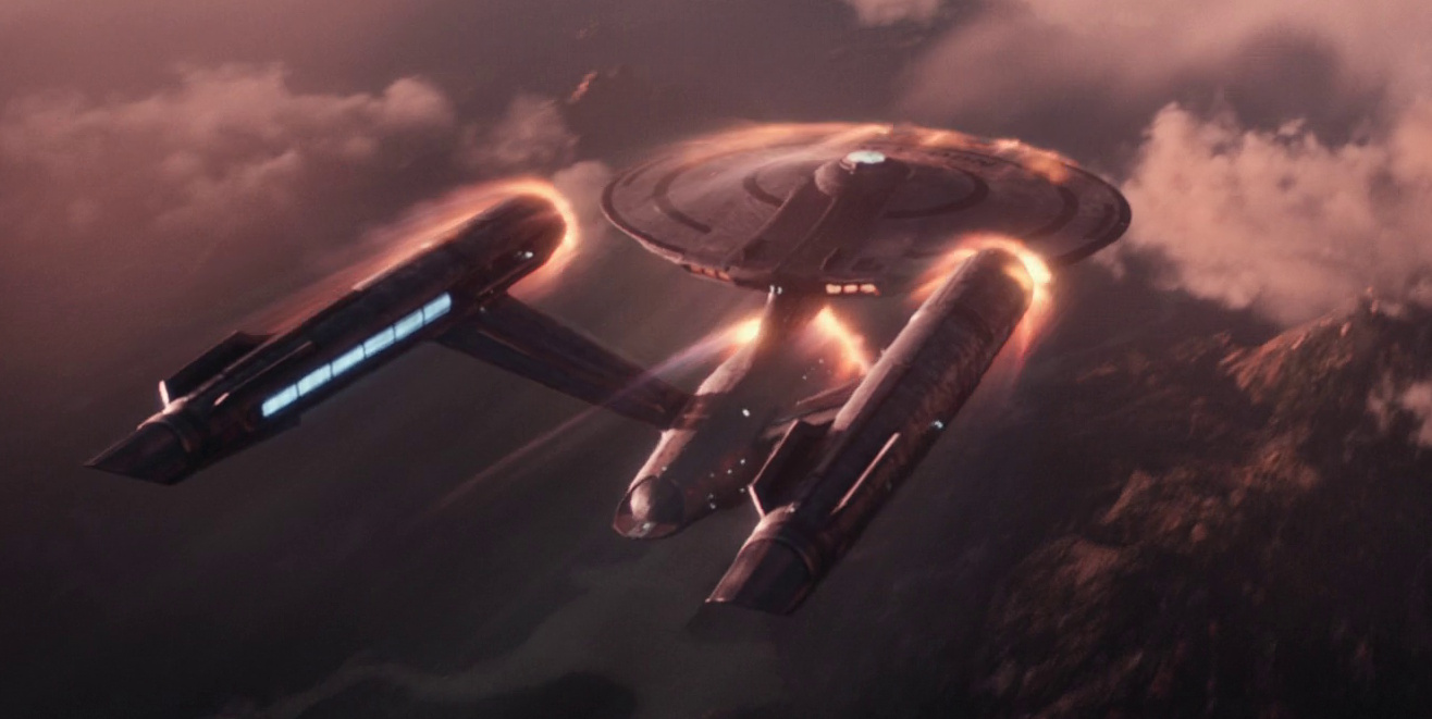Still frame from Star Trek: Strange New Worlds 3x03: Shuttle to Kenfori, showing the USS Enterprise in the planet's atmosphere.