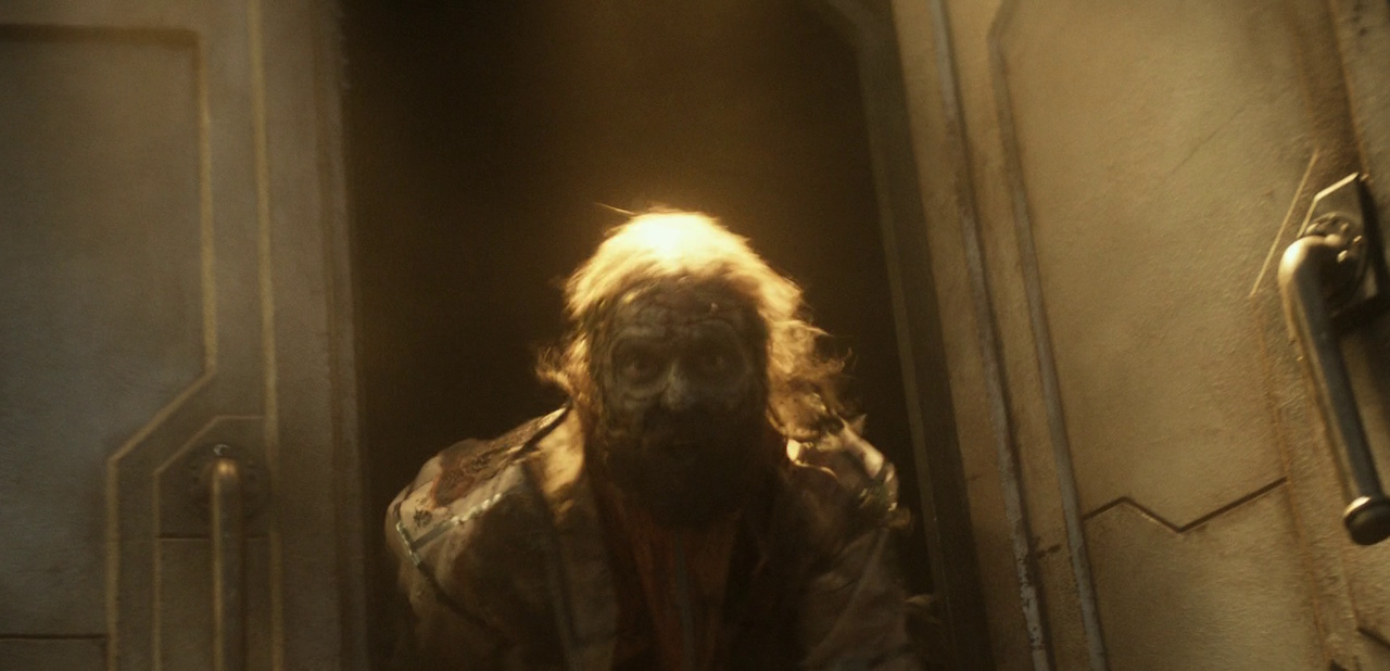 Still frame from Star Trek: Strange New Worlds 3x03: Shuttle to Kenfori, showing a zombie emerging from an open hatch.