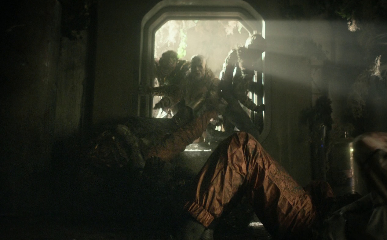 Still frame from Star Trek: Strange New Worlds Season 3 showing "zombies" breaking into a room.