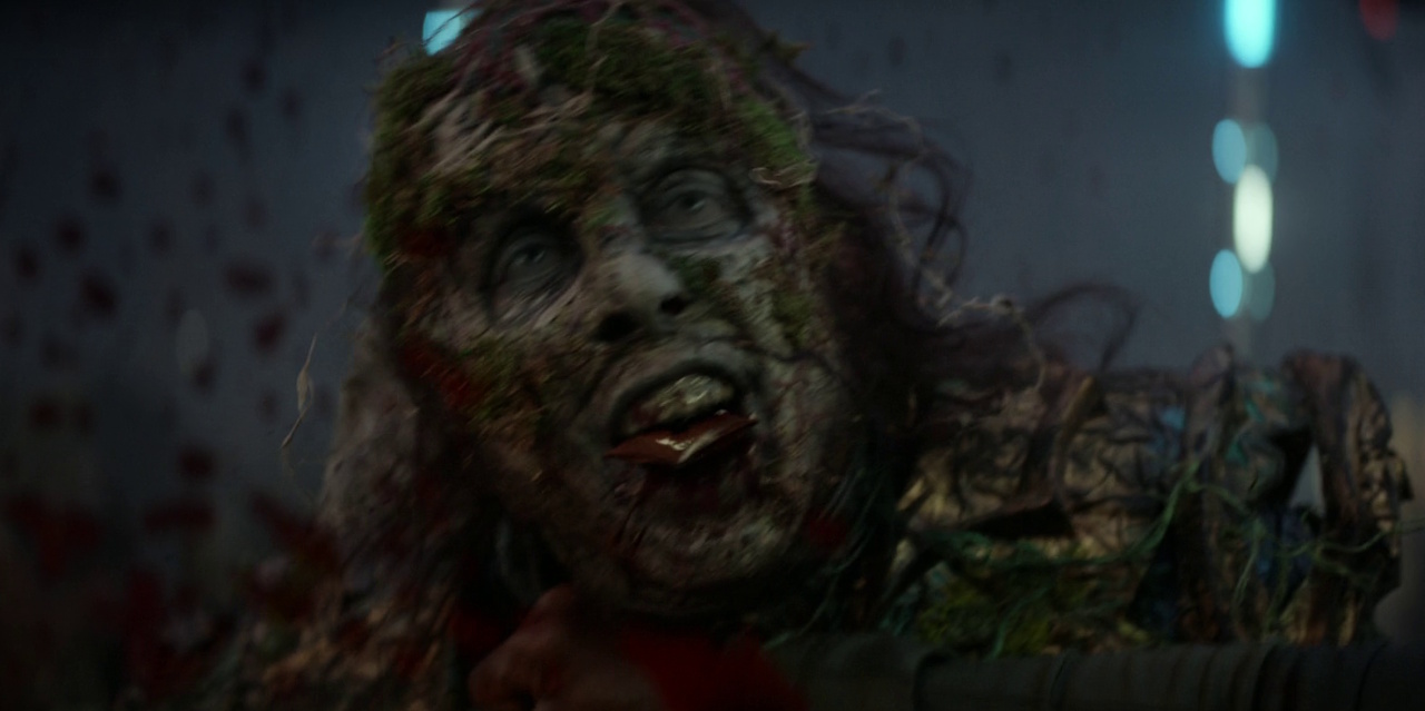 Still frame from Star Trek: Strange New Worlds 3x03: Shuttle to Kenfori, showing a zombie being stabbed.