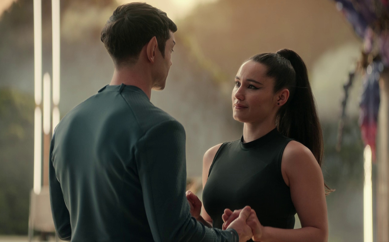 Still frame from Star Trek: Strange New Worlds 3x02 Wedding Bell Blues showing Spock and La'an dancing.