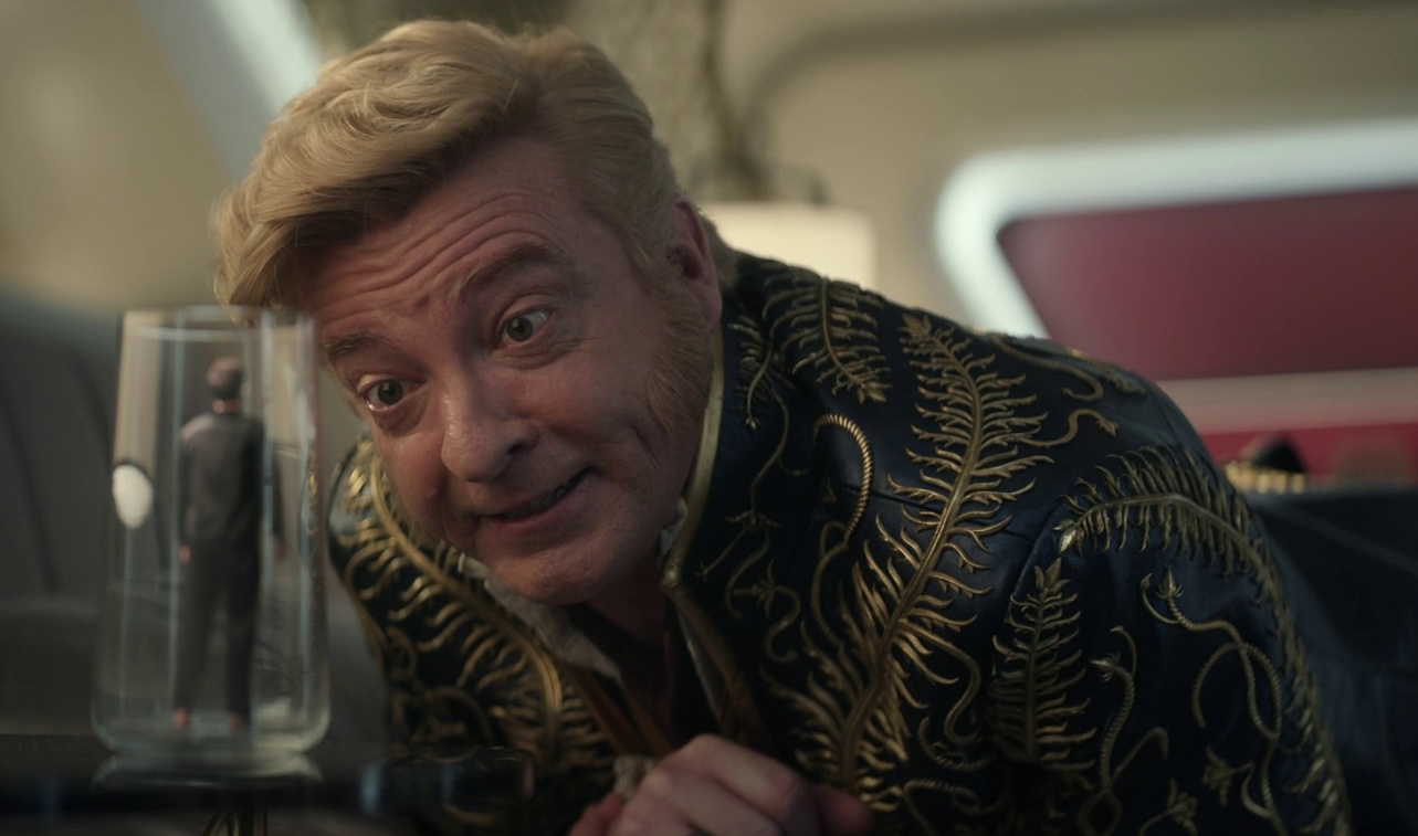 Still frame from Star Trek: Strange New Worlds 3x02 Wedding Bell Blues showing Trelane playing a trick on Spock.