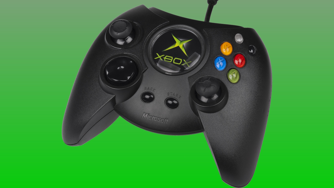 An Xbox "Duke" controller on a green background.