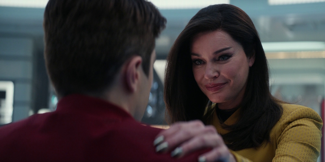 Still frame from Star Trek: Strange New Worlds 3x04 "A Space Adventure Hour," showing Scotty with Una.