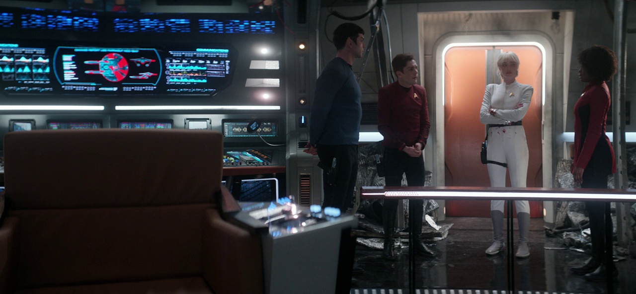 Still frame from Star Trek: Strange New Worlds 3x06 showing Spock, Scotty, Chapel, and Uhura on the bridge of the USS Farragut.