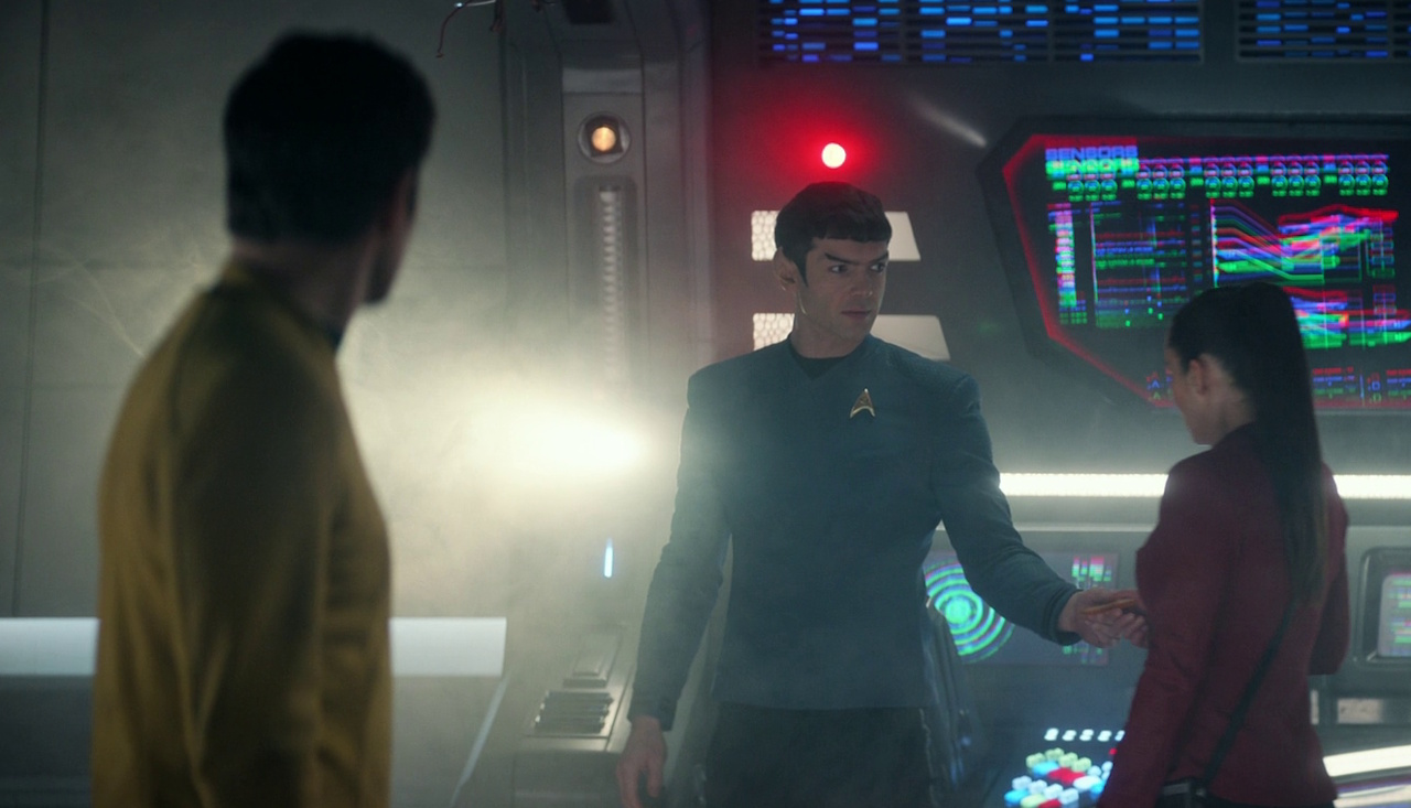 Still frame from Star Trek: Strange New Worlds 3x06: The Sehlat Who Ate Its Tail showing Kirk, Spock, and La'an.