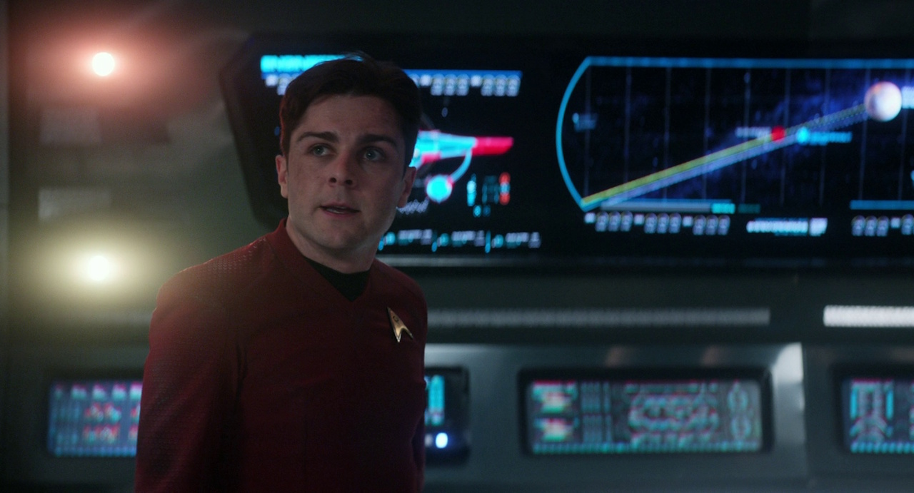 Still frame from Star Trek: Strange New Worlds 3x06: The Sehlat Who Ate Its Tail showing Scotty on the bridge.