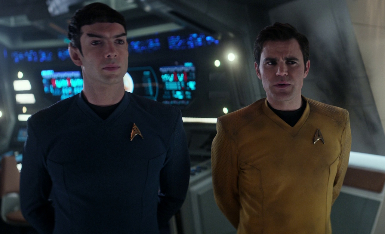 Still frame from Star Trek: Strange New Worlds 3x06: The Sehlat Who Ate Its Tail showing Spock and Kirk (Spirk).
