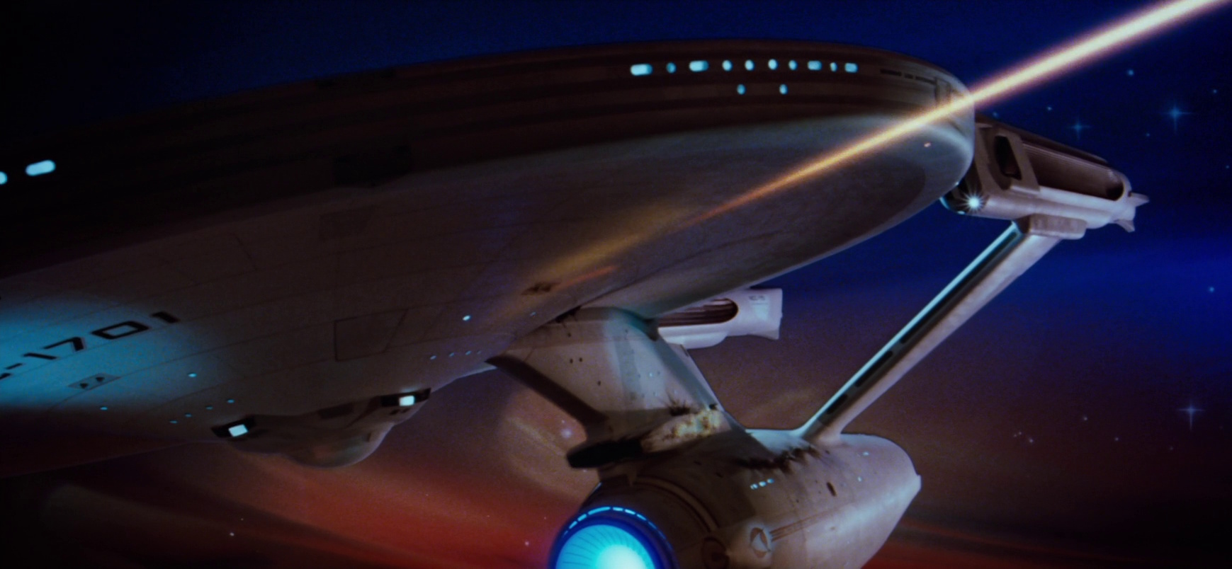 Still frame from Star Trek II: The Wrath of Khan showing the Enterprise firing phasers.