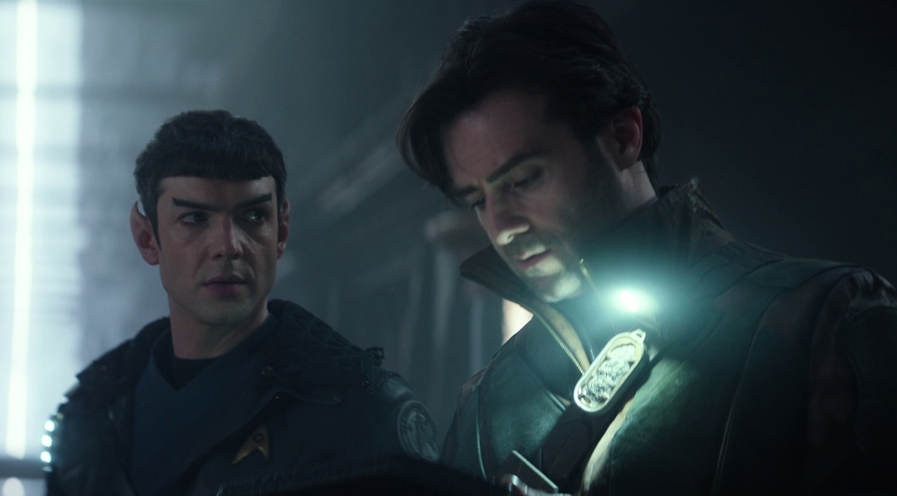 Still frame from Star Trek: Strange New Worlds 3x05 "Through the Lens of Time" showing Spock and Dr Korby on the away mission.