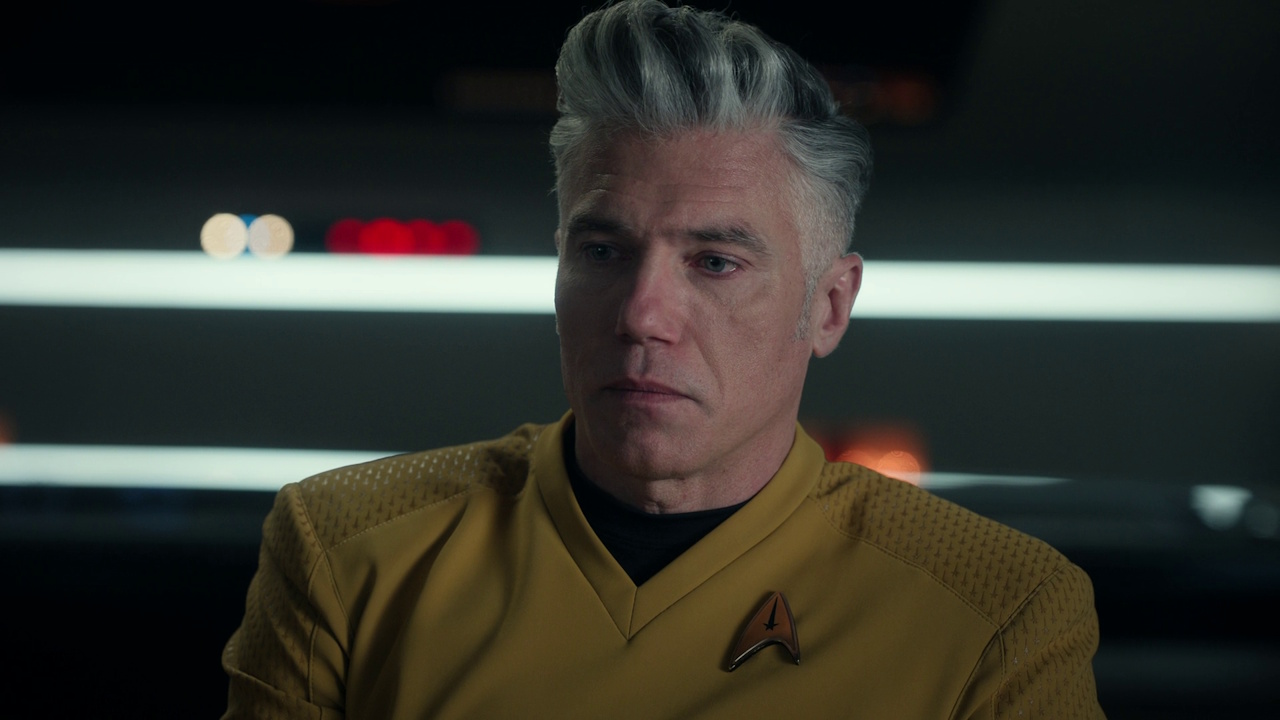 Still frame from Star Trek: Strange New Worlds S03E07 "What Is Starfleet?" showing Pike being interviewed.