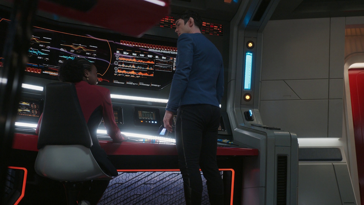 Still frame from Star Trek: Strange New Worlds S03E07 "What Is Starfleet?" showing Uhura and Spock on the bridge.
