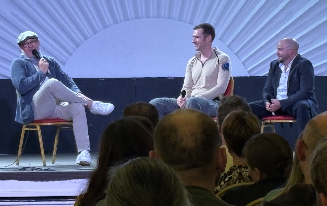 Photograph from Destination Star Trek 2025 showing Connor Trinneer with two convention hosts.