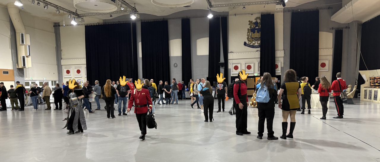 Photograph from Destination Star Trek 2025 showing attendees on the convention floor with their faces censored.