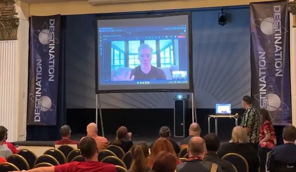 Photograph from Destination Star Trek 2025 showing Anson Mount's video-call.