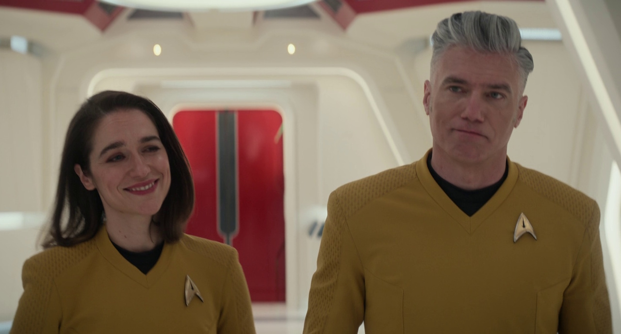 Still frame from Star Trek: Strange New Worlds 3x10 (New Life and New Civilizations) showing Captains Batel and Pike.