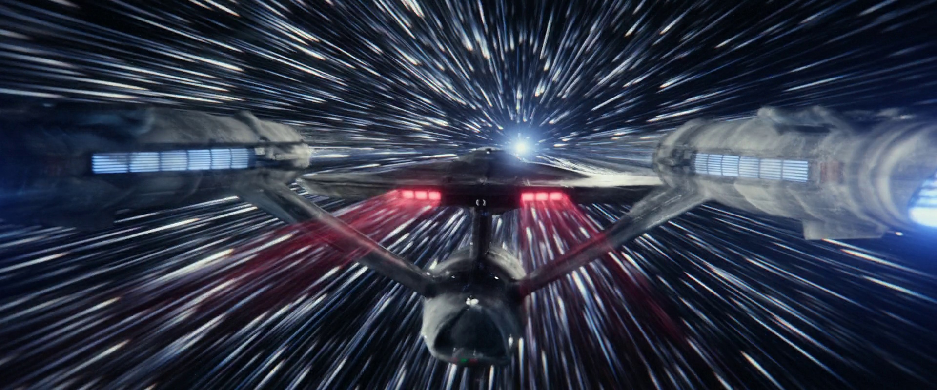 Still frame from Star Trek: Strange New Worlds showing the Enterprise at warp.