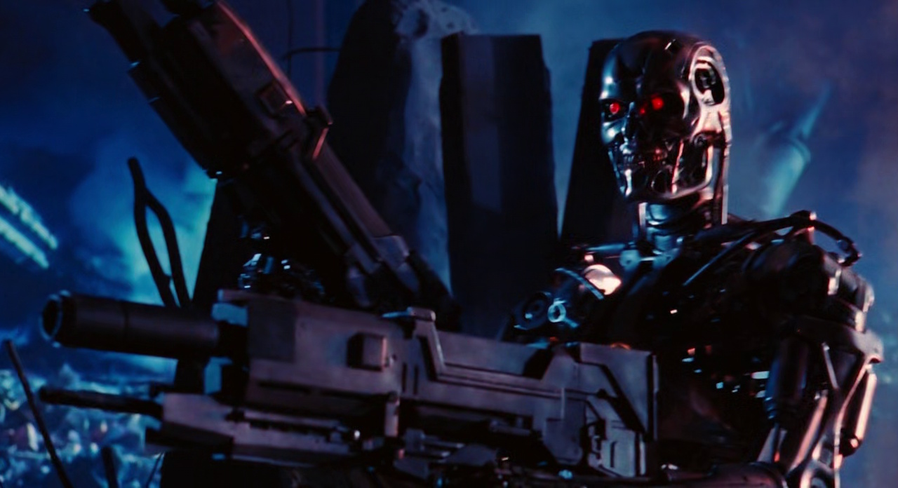 Still frame from Terminator 2 showing a Terminator wielding weapons.