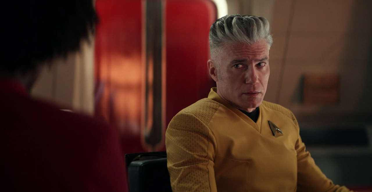 Still frame from Star Trek: Strange New Worlds 3x09: Terrarium, showing Pike looking at Uhura.