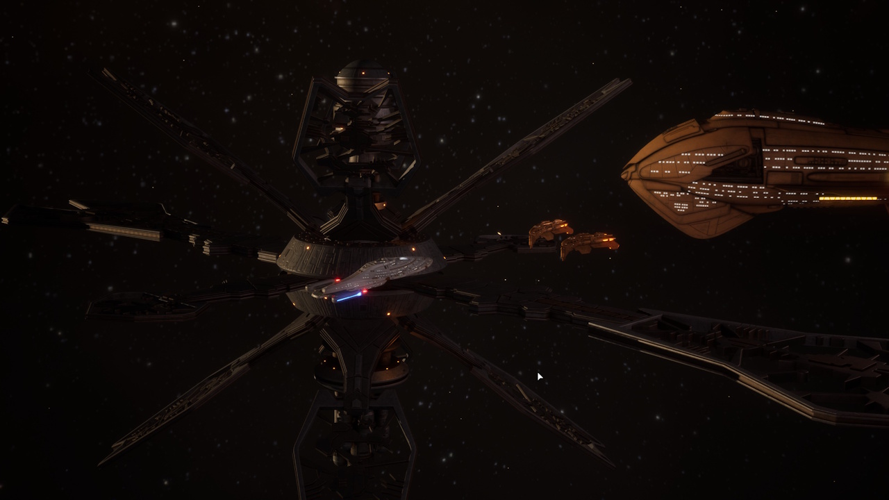 Screenshot of Star Trek: Voyager - Across The Unknown (demo version) showing the USS Voyager, the Caretaker's Array, and Kazon ships.