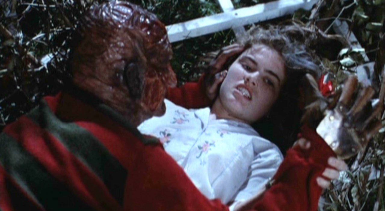 Still frame from A Nightmare on Elm Street showing Freddy and Nancy.