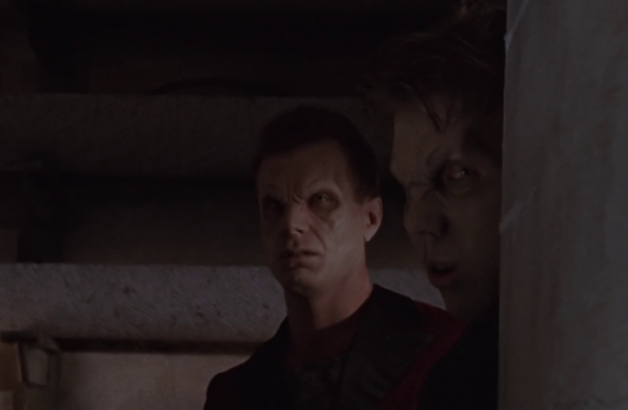 Still frame from Buffy the Vampire Slayer showing two Season 1 vampires.