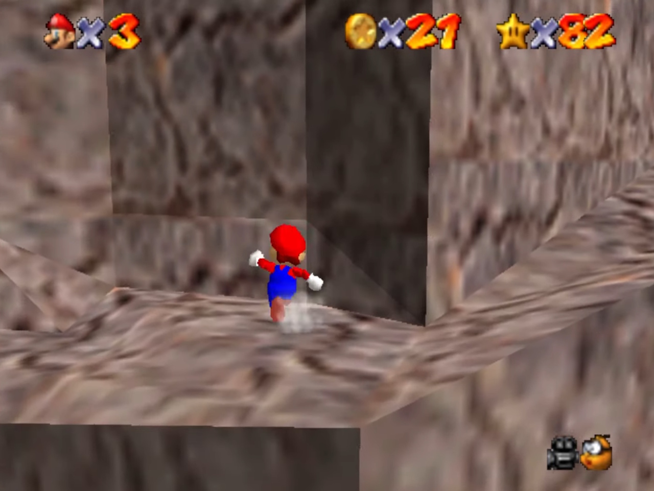Screenshot of Super Mario 64 showing Mario approaching a wall.