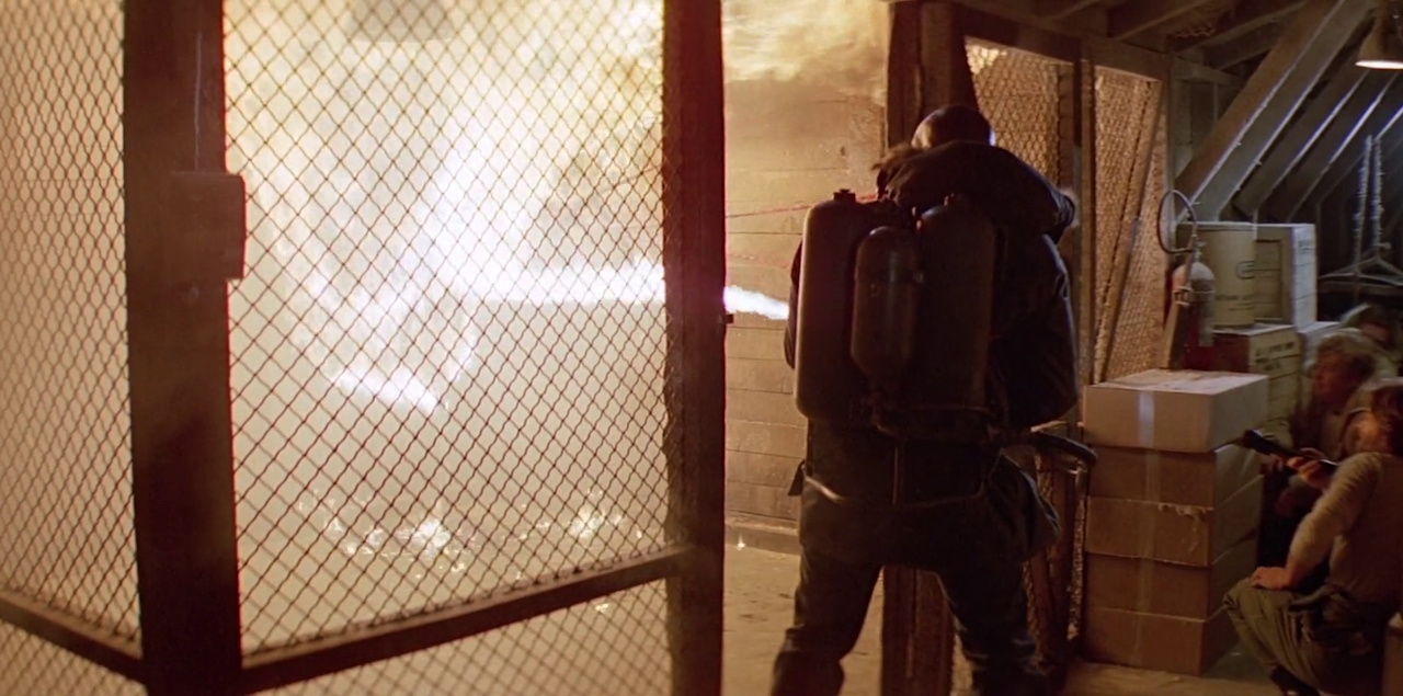 Still frame from The Thing showing a character using a flamethrower.