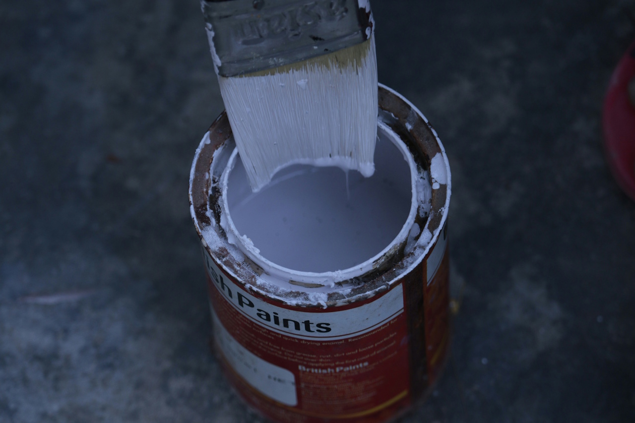 Stock photo of a paint can and paintbrush.