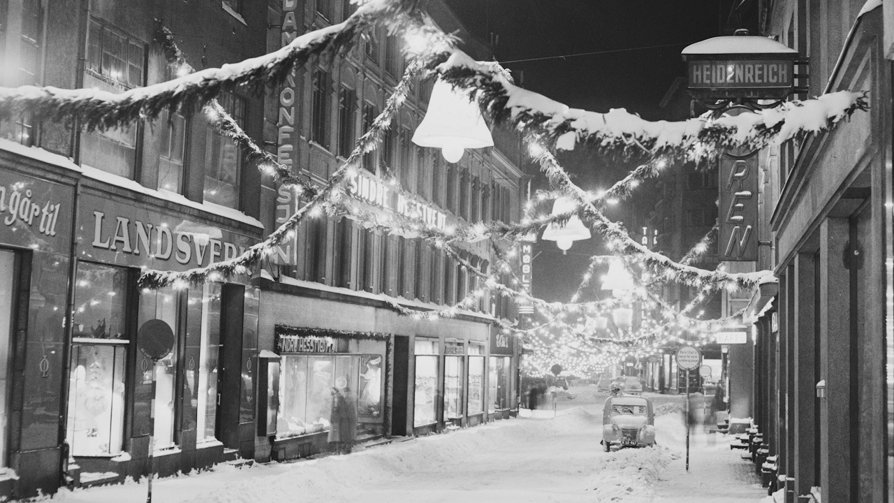 Vintage photo of a snowy, Christmassy scene in Norway.