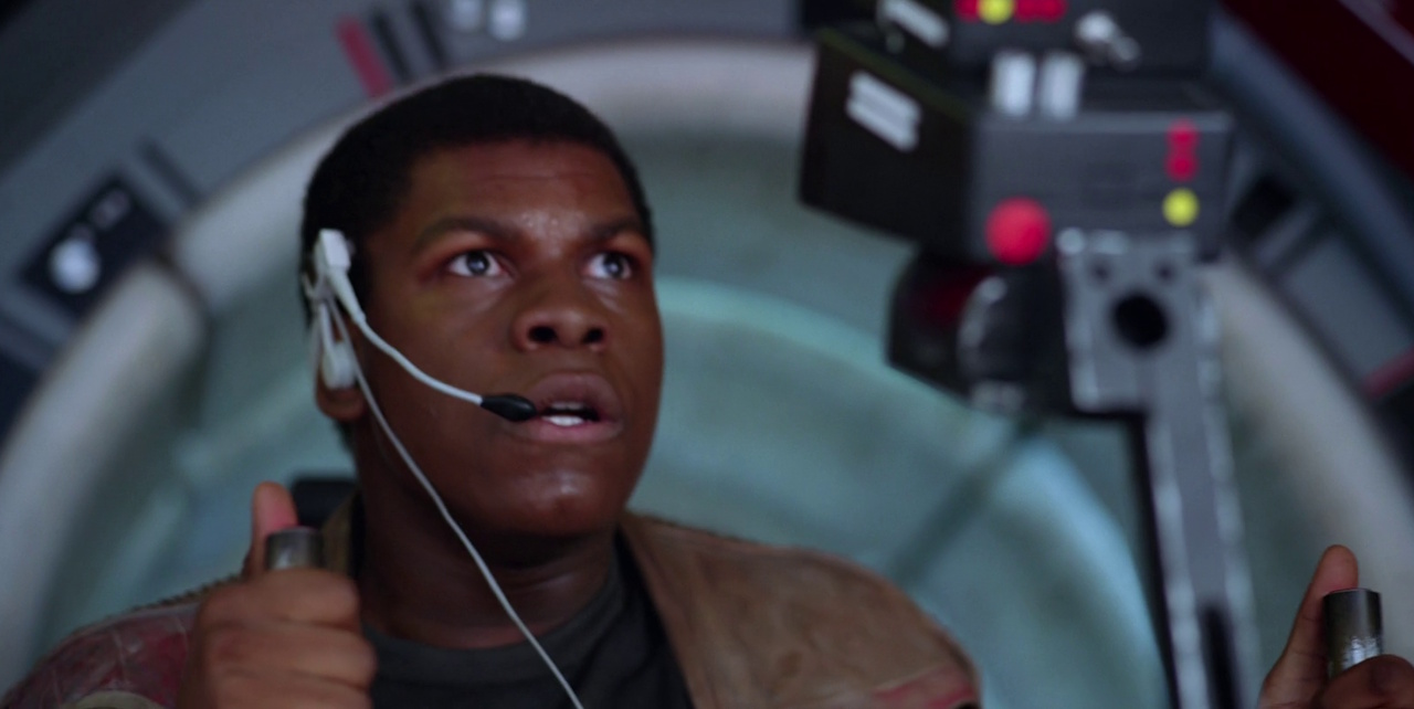 Still frame from Star Wars VII: The Force Awakens (2015) showing Finn aboard the Millennium Falcon.