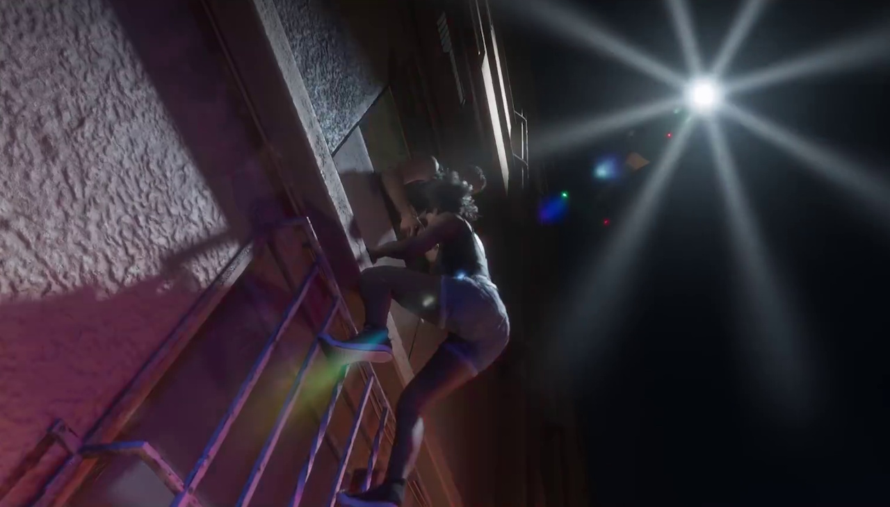 Still frame from the second GTA VI trailer showing two people hiding from a helicopter.