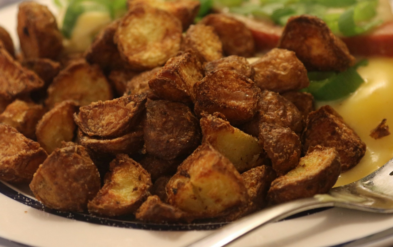 Stock photo of roast potatoes on a plate.