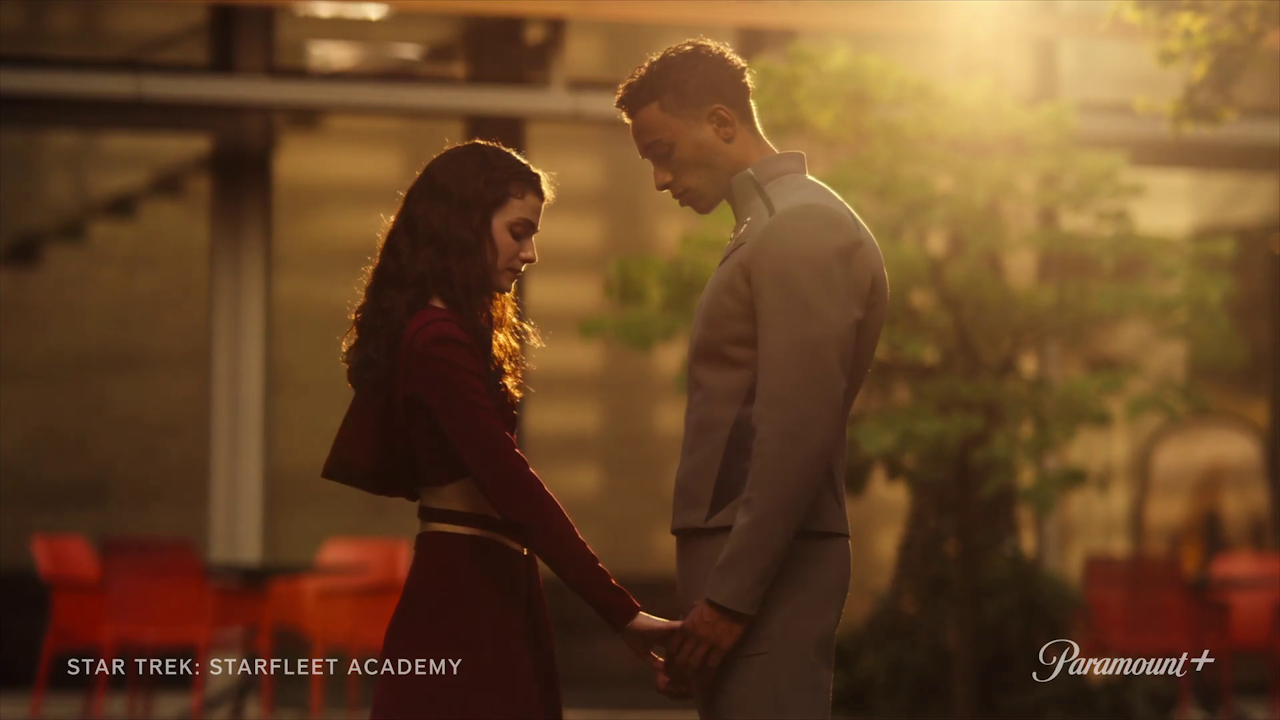 Still frame from the Star trek: Starfleet Academy trailer showing Tarima and Caleb holding hands.