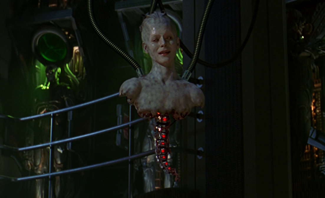 (Cropped) still frame from Star Trek: First Contact showing the introduction of the Borg Queen.