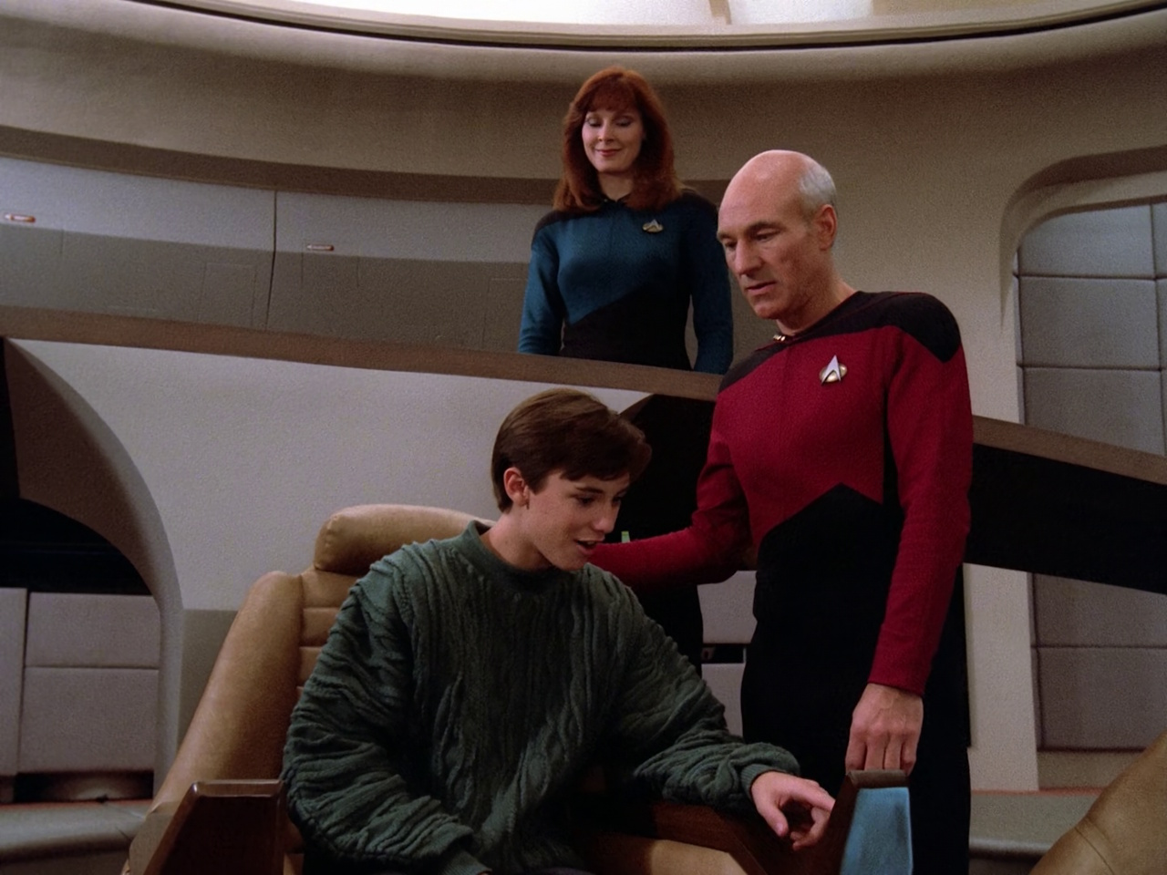 Still frame from Star Trek: TNG S1, showing Picard, Dr Crusher, and Wesley.