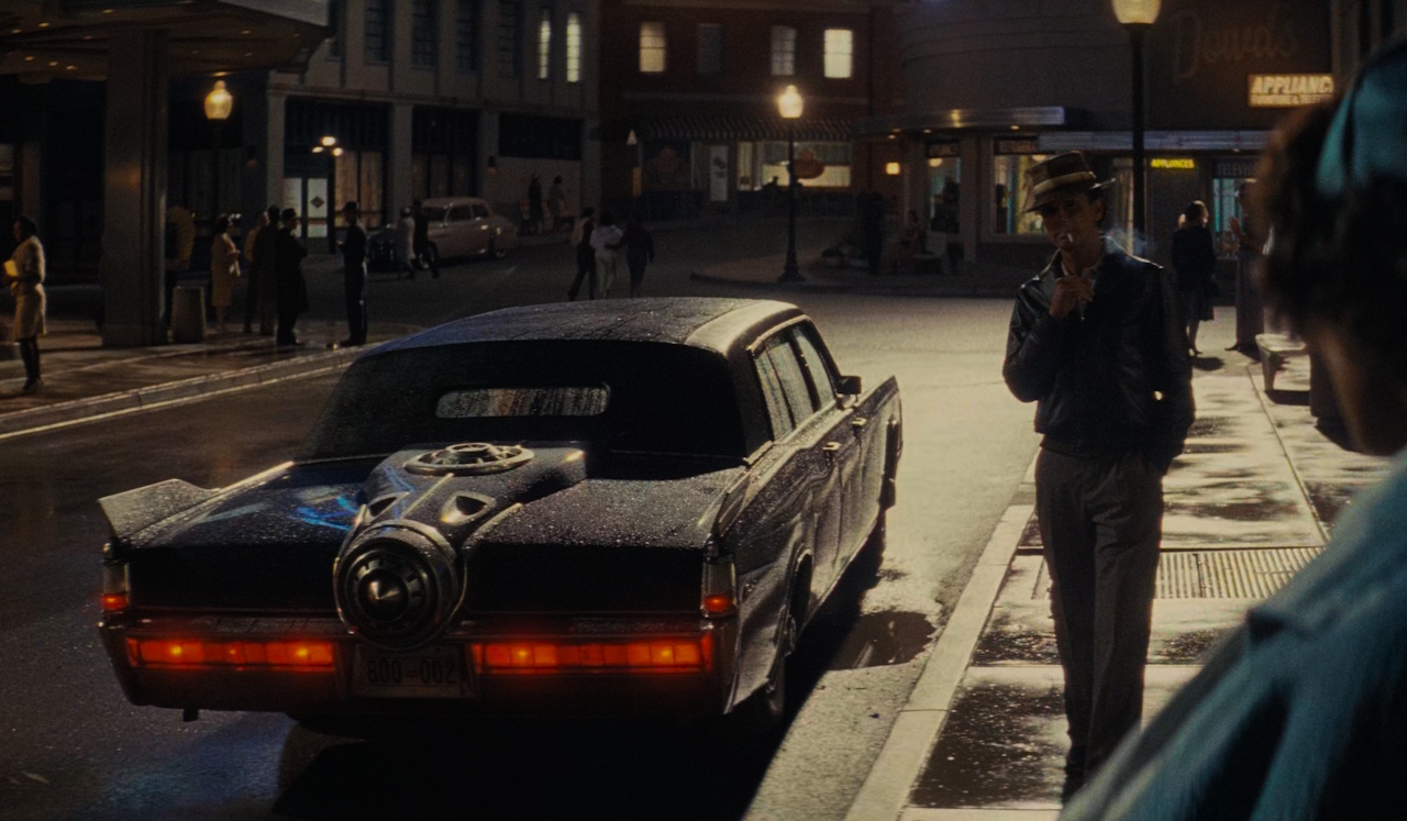 Still from Fallout S2 showing Cooper and a car.