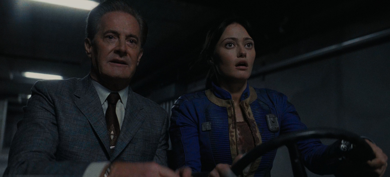 Still frame from Fallout S2 showing Hank and Lucy driving.