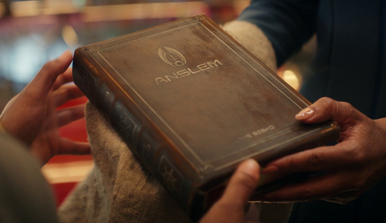 Still frame from Star Trek SFA S1 showing Jake's book Anslem.