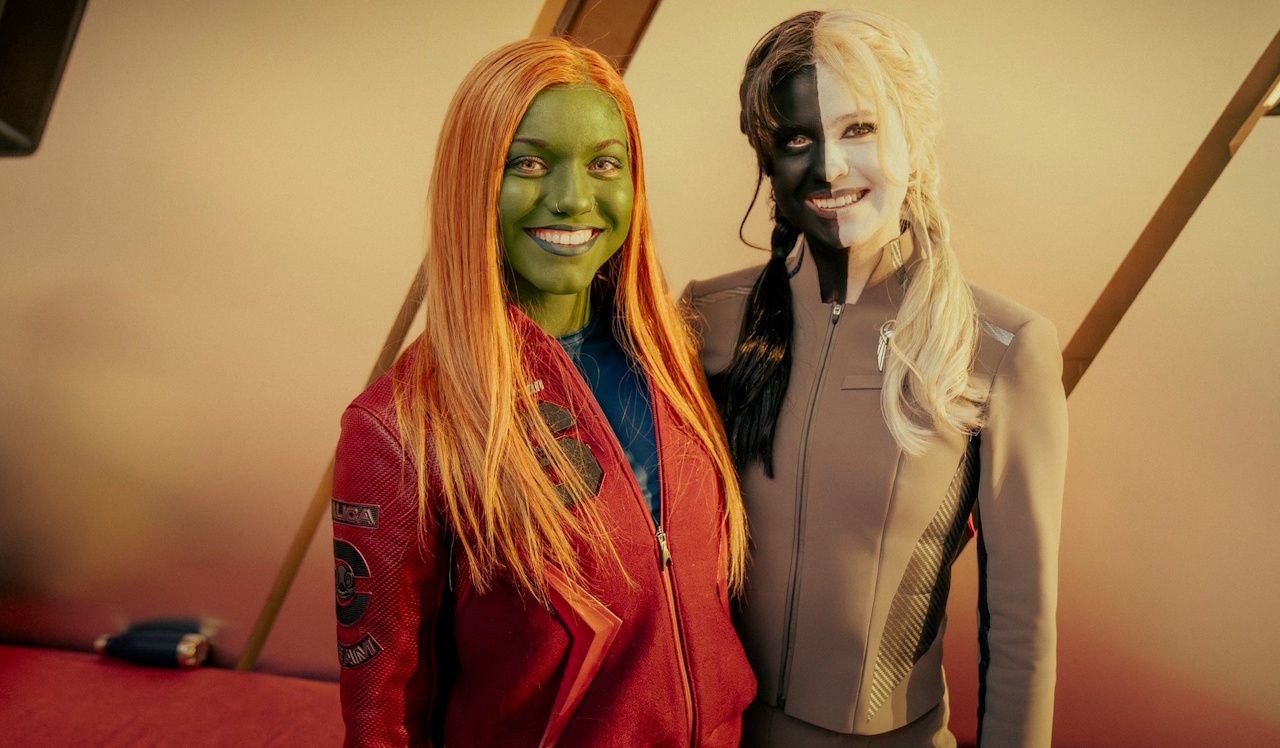 Behind-the-scenes photo from Starfleet Academy S1 showing two extras in alien makeup