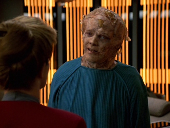Still frame from Threshold showing (mutating) Paris and Janeway
