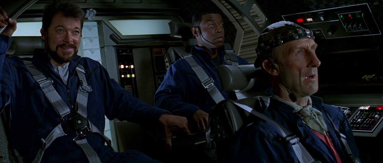 Still frame from First Contact showing Riker, Geordi, and Cochrane on the Phoenix