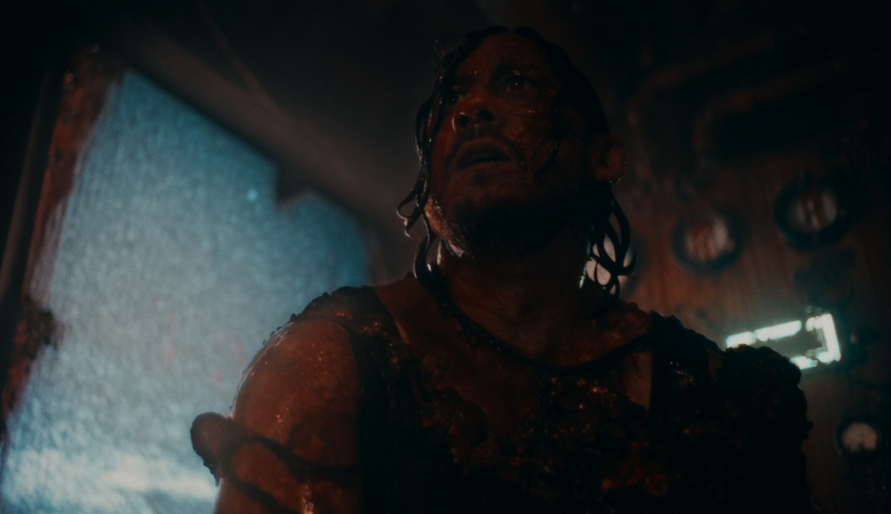 Still frame from Iron Lung (2026) showing Simon covered in blood