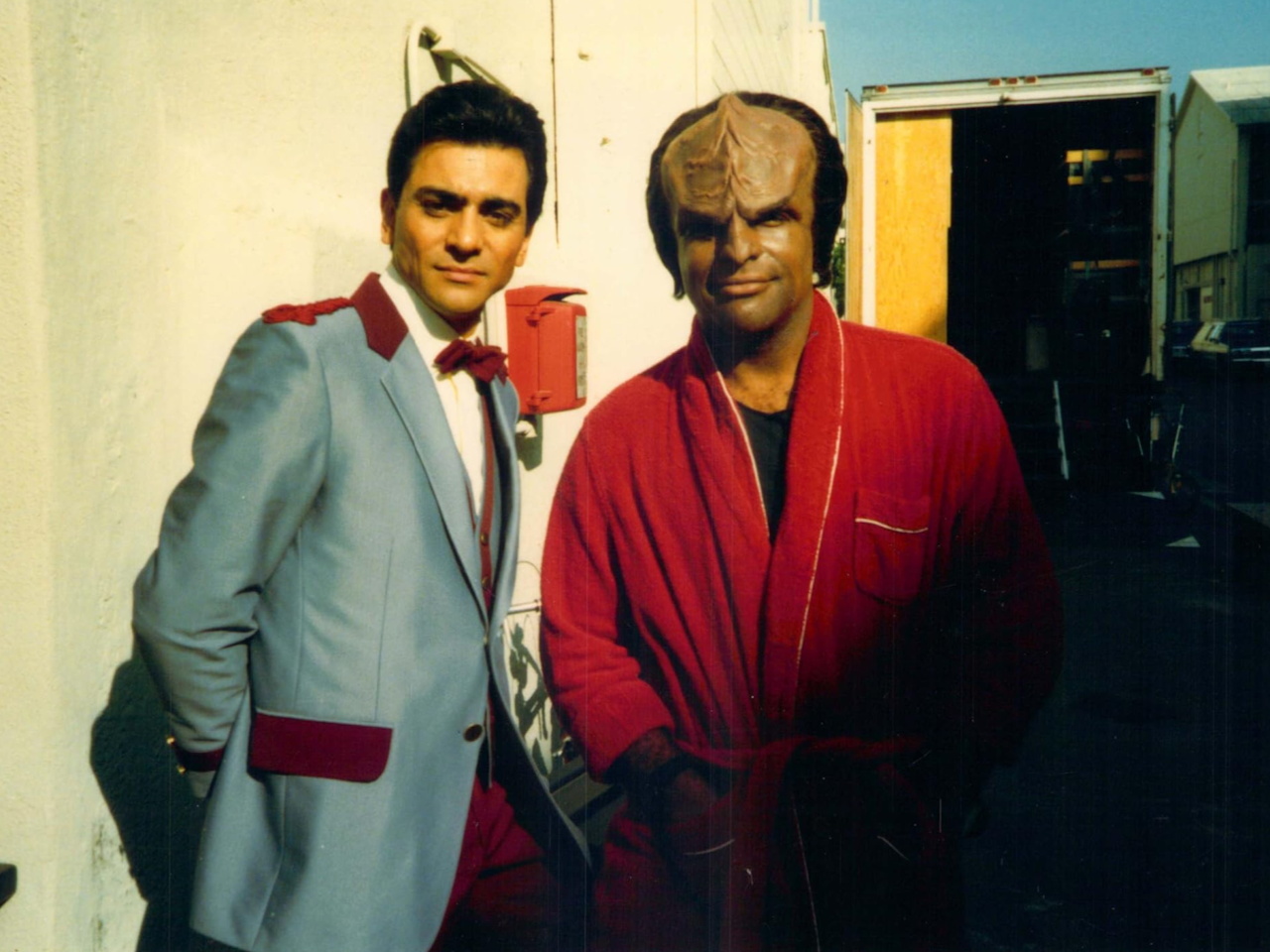 A behind-the-scenes photo from Star Trek TNG S2 showing Michael Dorn and a guest star
