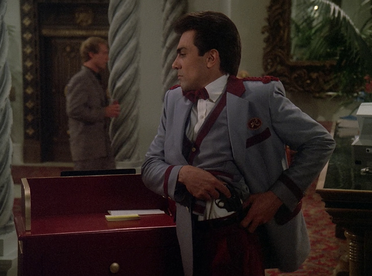 Still frame from Star Trek TNG The Royale showing the bellboy