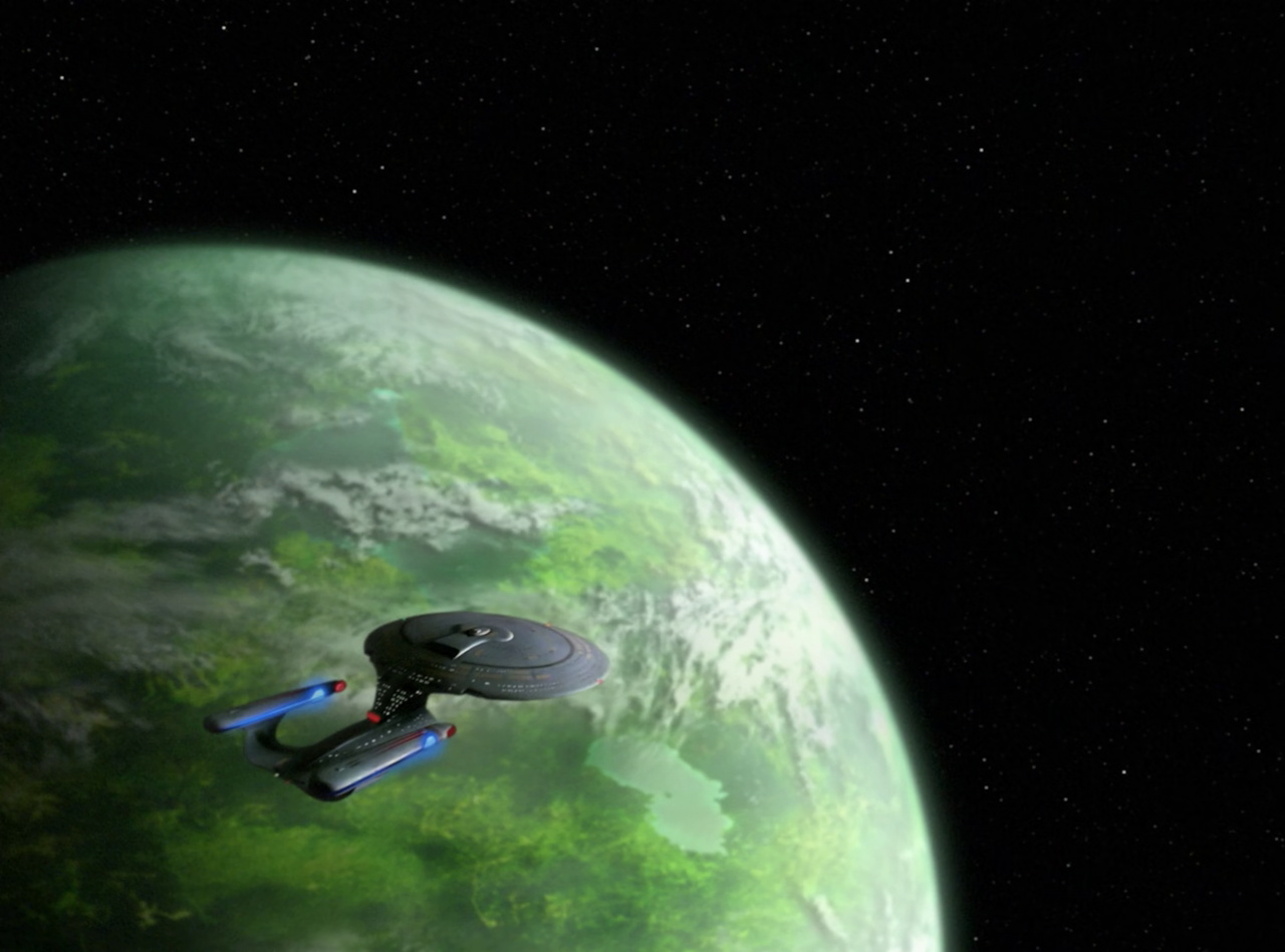 Still frame from Star Trek TNG The Royale showing the Enterprise-D and Theta VIII