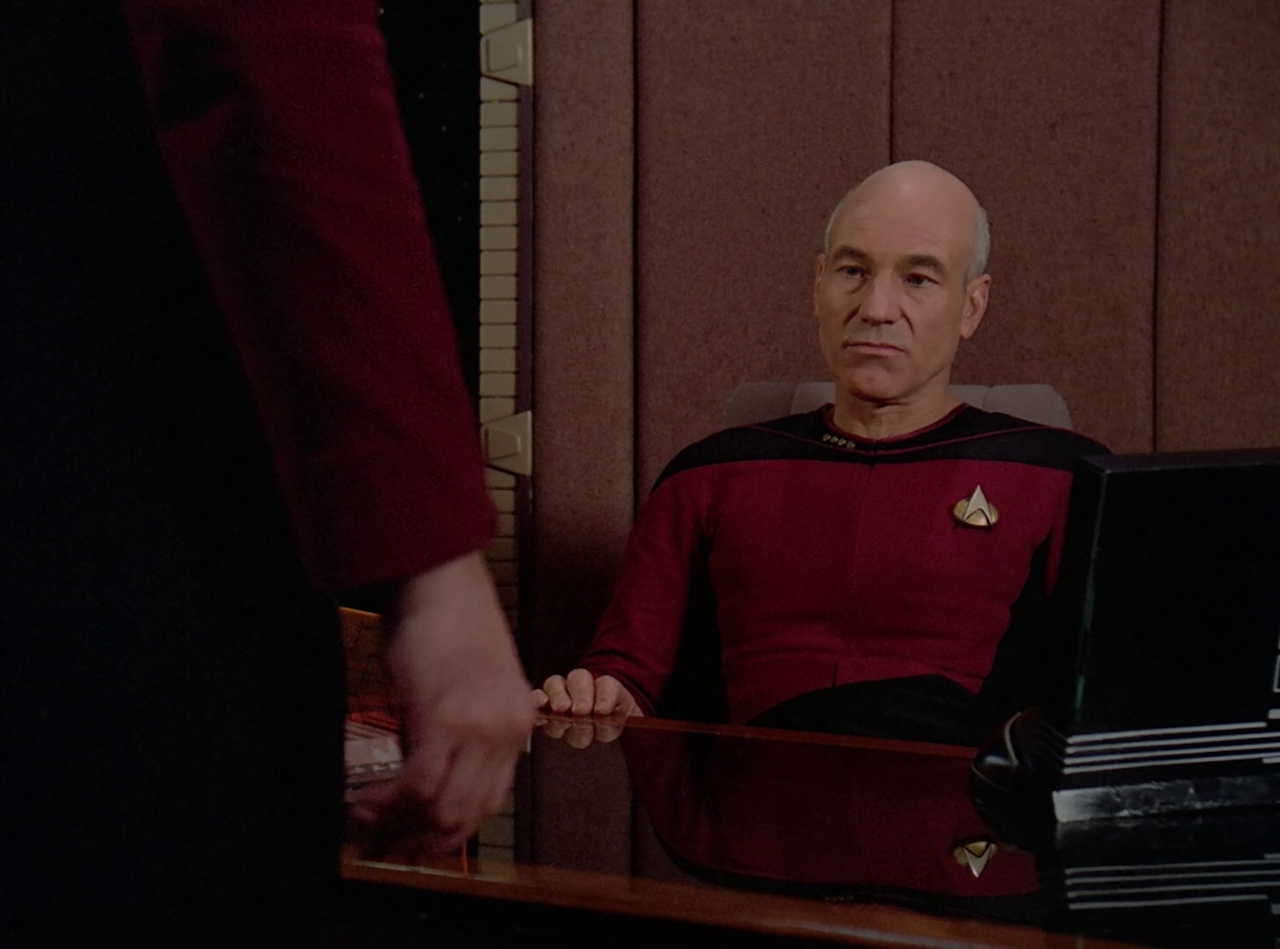 Still frame from Star Trek TNG The Royale showing Picard
